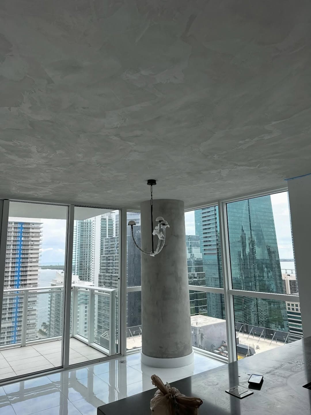 High-rise interior with polished plaster walls and ceiling