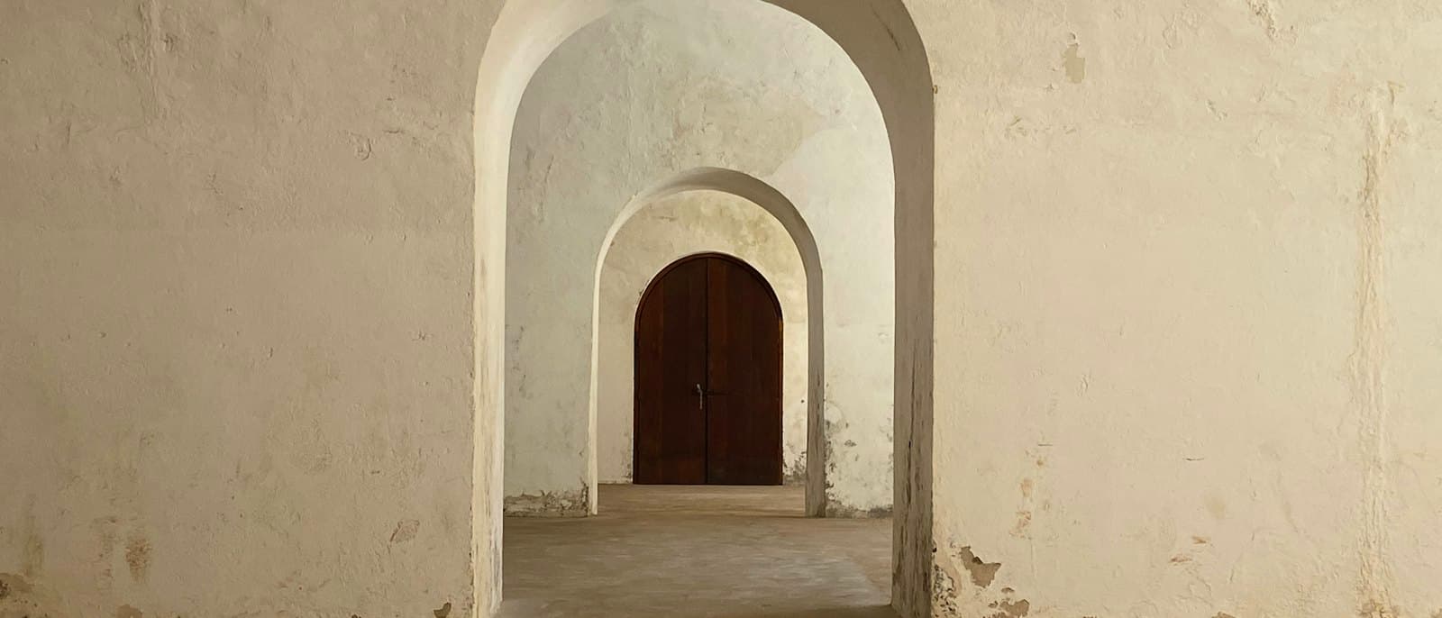 Succession of plastered arches in soft light
