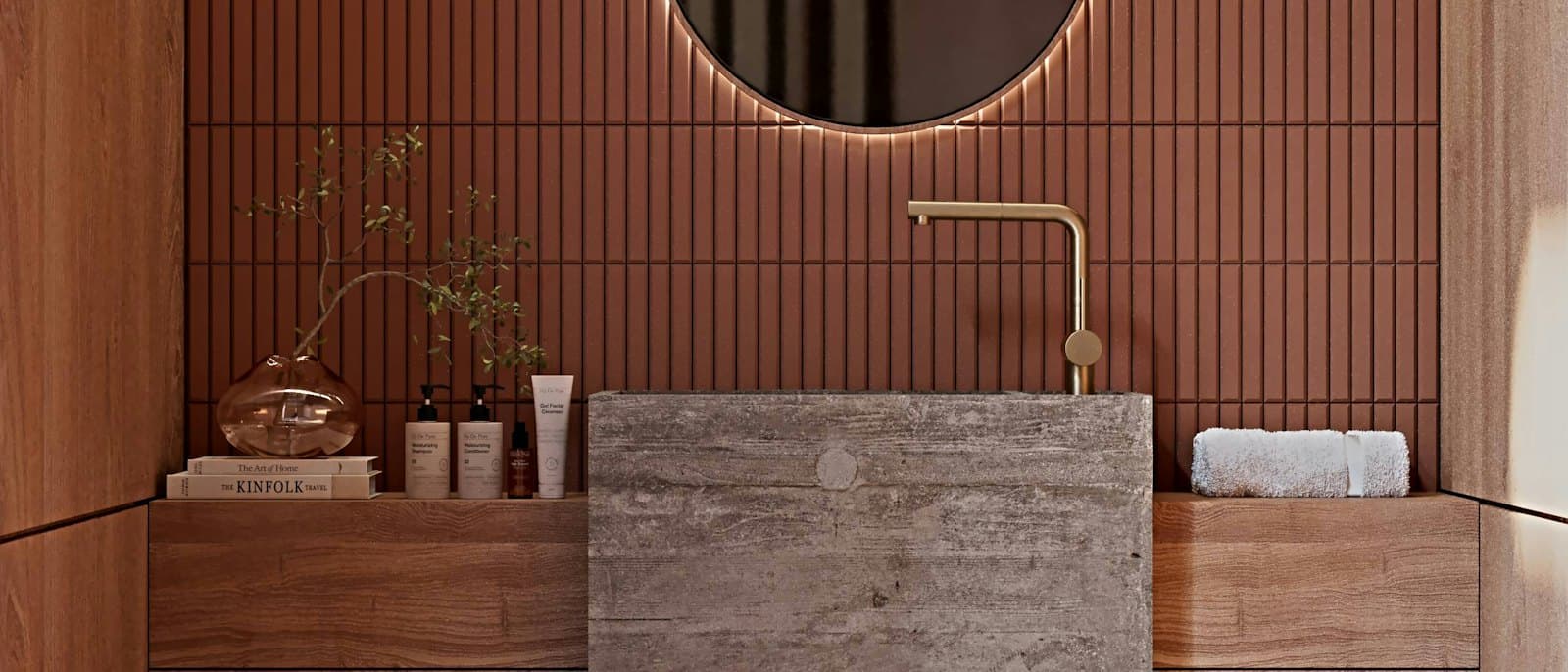 Bathroom with terracotta plaster walls and a round mirror